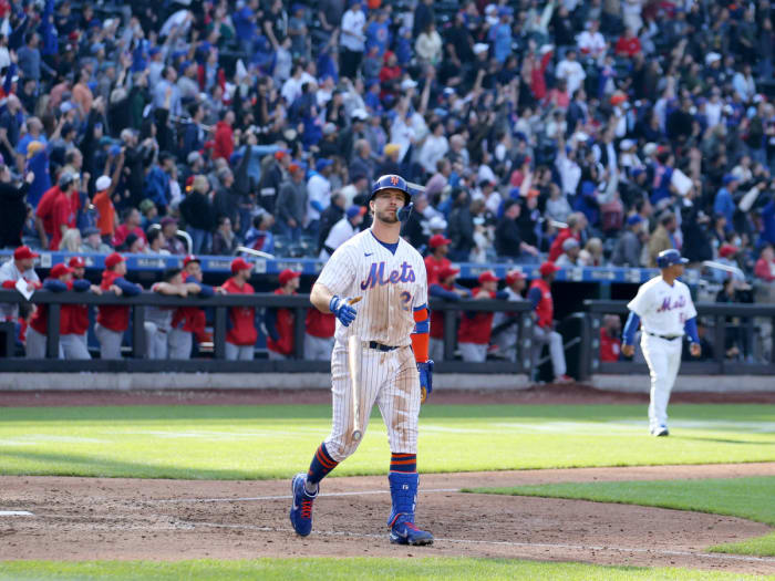 May 19, 2022; New York City, New York, USA; New York Mets first baseman Pete Alonso (20) flips his bat after hitting a walkoff two run home run against the St. Louis Cardinals in the tenth inning at Citi Field.